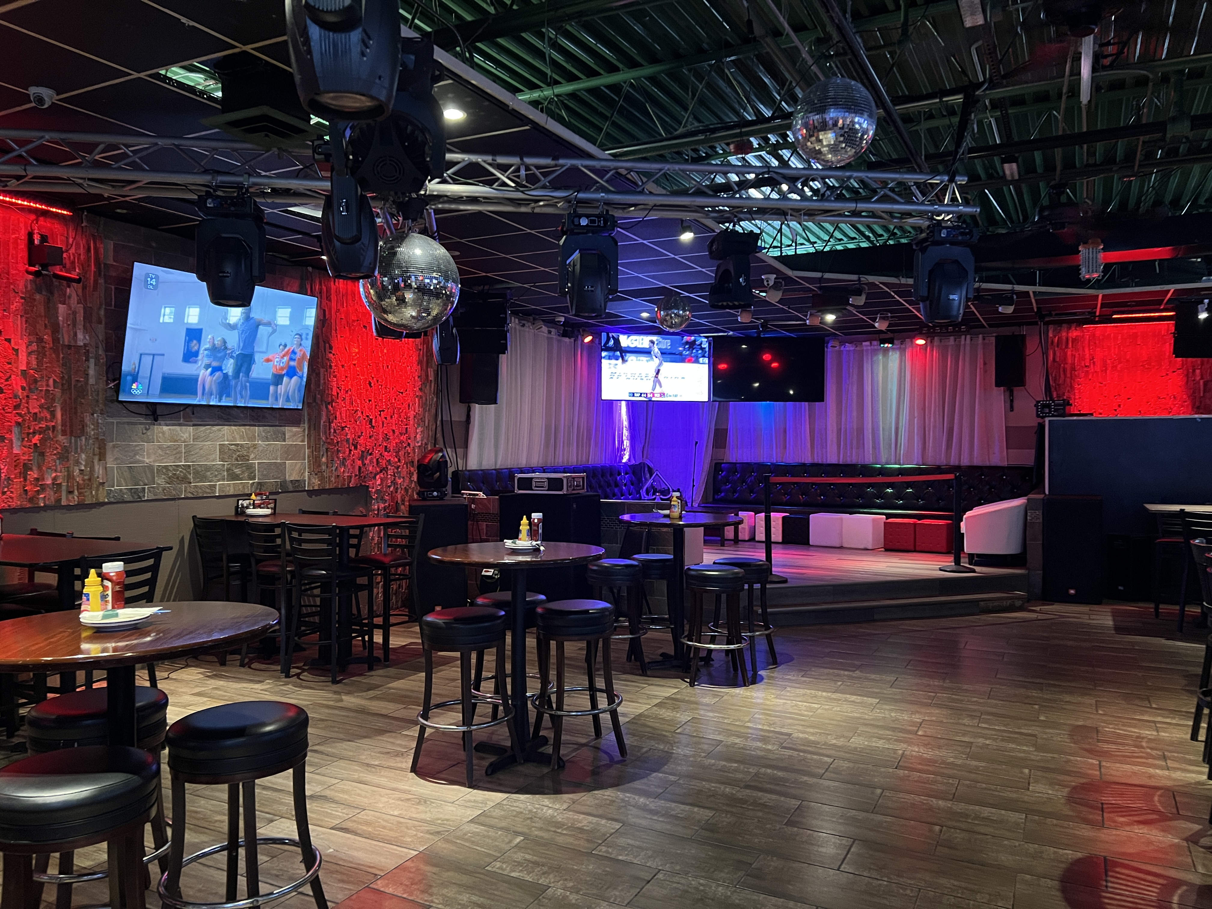 Dance floor with disco balls and stage lighting